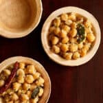 Channa sundal served in 2 small round bowls.