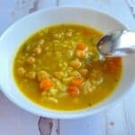 Mulligatawny soup made with chickpeas in a white round bowl.